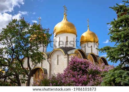 Dormition (Assumption) Cathedral inside Moscow Kremlin, Russia. Nice scenic view of old Russian Orthodox cathedral, landmark of Moscow. Ancient church with golden domes in Moscow center in summer. Royalty-Free Stock Photo #1986101873