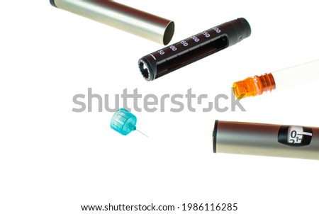 Insulin pen injector.  Insulin pen fill with needle on white background. Diabetes Day.