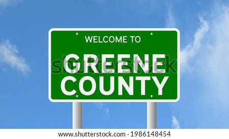 Welcome to Greene County sign with real sky background