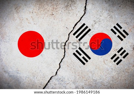 Flags of Japan and Korea painted on cracked wall background. Concept of the Conflict between Japan and the Korean Authorities.