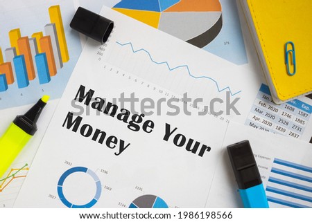 Conceptual photo about Manage Your Money with handwritten text. 
