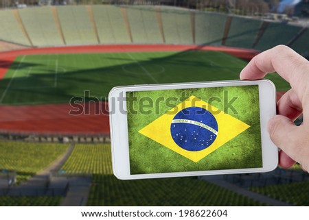 Taking a picture with a smartphone at the stadium