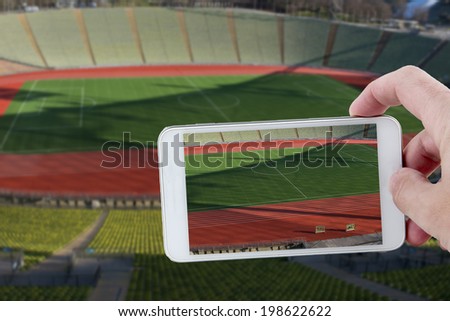 Taking a picture with a smartphone at the stadium