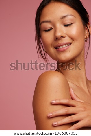 Attractive female model with flawless skin. Asian woman with healthy and perfect skin.