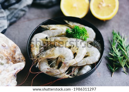 Raw shrimps prawns in bowl, Fresh shrimp seafood with herbs and spice for cooked food 