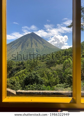 Scenery photo of Flores Mount Inerie in Bajawa through a window frame