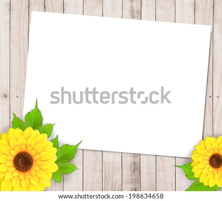 Sunflowers and paper frame on wood background 