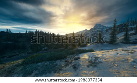 Misty and moody snow mountains sunrise landscape with dark clouds