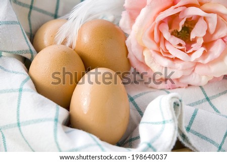 close up eggs in basket with flower
