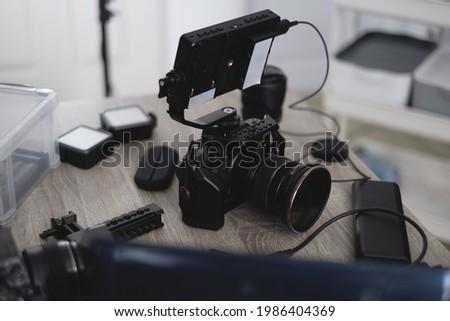 top view of work space photographer with digital camera and camera accessory