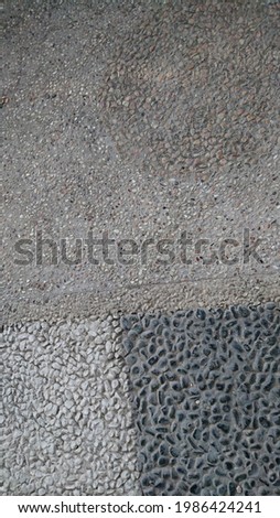 6 june 2021, this decoration is a tile from the car park at my friend's house, the picture is unique because there is a mixture of sand and small stones that are put together