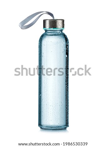Glass sport water bottle with metal top and drops on white background Royalty-Free Stock Photo #1986530339
