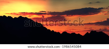 Orography. A clear outline of mountain peaks against the background of an orange sunset - skyline. But also prosaic hypsometric profile of the area in topography, vertical section Royalty-Free Stock Photo #1986545084