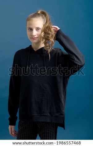 Pretty teenage girl in black stylish clothes