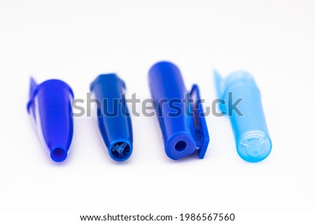 pen caps have a small hole at the top Royalty-Free Stock Photo #1986567560