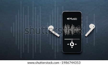 Music concept. Audio beats, sound headphones, music application on mobile smartphone screen. Record sound voice on dark background. Recording studio or podcasting banner with copy space