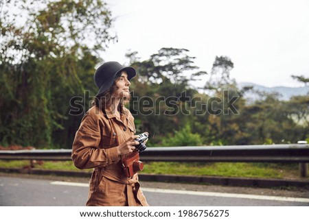 Beautiful young female caucasian tourist in equatorial africa jungles