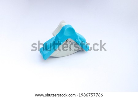 Blue and white corner cutter rounder punch for cutting card photo paper. Isolated on white background.