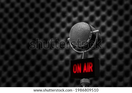 microphone in radio station studio and on air sign