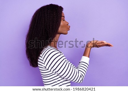 Profile photo of cute millennial lady blow kiss wear striped sweater isolated on violet color background
