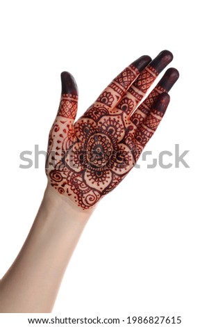 Woman with henna tattoo on palm against white background, closeup. Traditional mehndi ornament Royalty-Free Stock Photo #1986827615