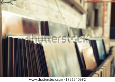 Many different vinyl records in store, closeup Royalty-Free Stock Photo #1986840692