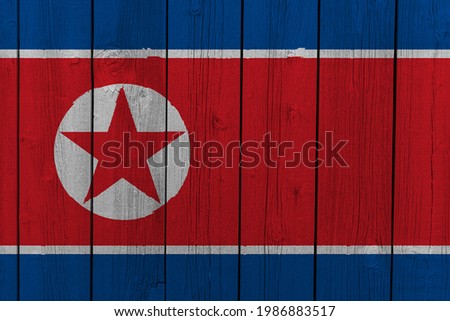 The National Flag of the Peoples Republic of Korea (North Korea) painted on a wooden wall. 
