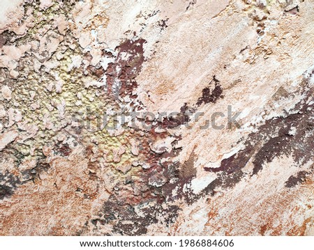 Texture of red and beige stone decorative plaster or concrete wall. Abstract background 