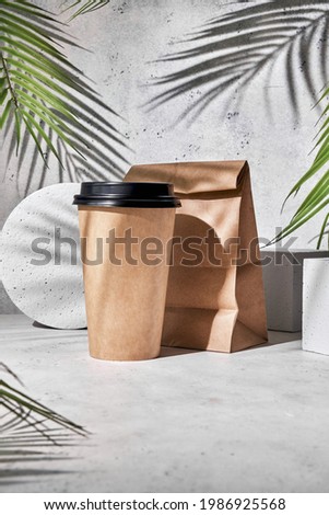 Take out coffee. Paper cup of coffee on grey background