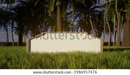 Blank sign in the grass with tropical trees in the background. Tourism
