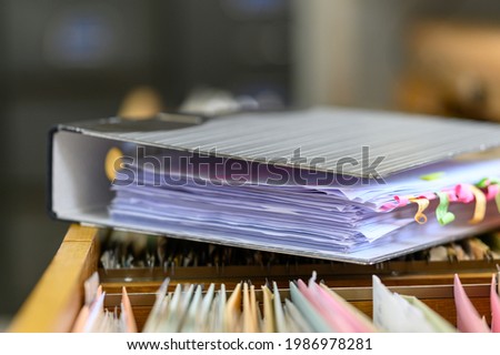 Close up of documents file in file cabinet background