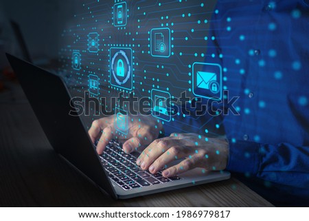 Cyber security IT engineer working on protecting network against cyberattack from hackers on internet. Secure access for online privacy and personal data protection. Hands typing on keyboard and PCB Royalty-Free Stock Photo #1986979817