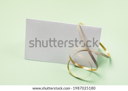 Blank Greeting Card and Gold Ribbon Holiday Mock Up with Decorations Horizontal Place for Text
