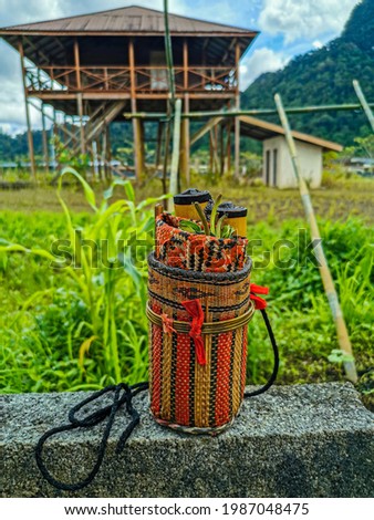 A beautiful hand made and traditional of "Tepak Sirih". It is use to store betels by the Bidayuh community in Sarawak. Royalty-Free Stock Photo #1987048475