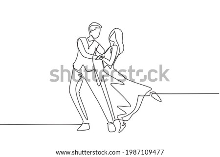 Single continuous line drawing romantic man and woman professional dancer couple dancing tango, waltz dances on dancing contest dancefloor. Dynamic one line draw graphic design vector illustration Royalty-Free Stock Photo #1987109477