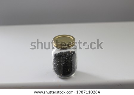 a jar full of black turtle beans ready to use 