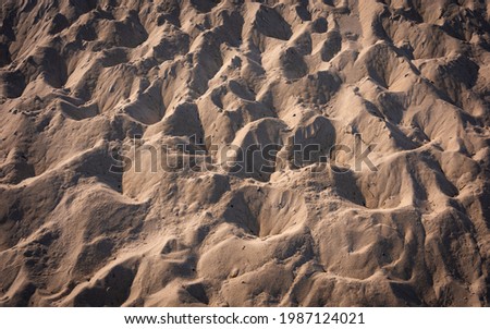 Abstract geometry of footprints over sand dune on Cape Cod beach