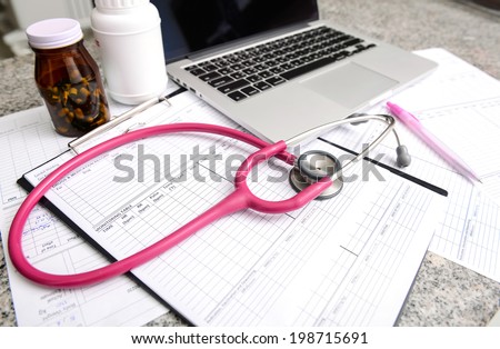stethoscope and labtop and other medical object on the table