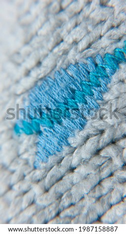 Flower embroidery colorful threads in grey wool