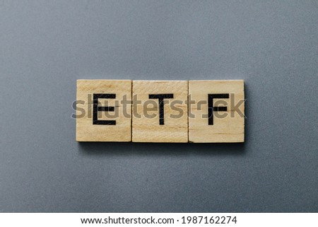 ETF Exchange-traded fund on wooden letters