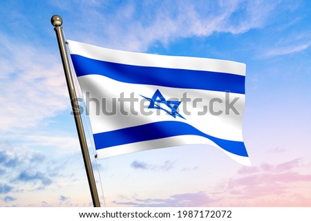 Large Israel flag waving in the wind on sky background