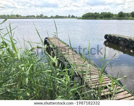 Wooden old bridge on the lake