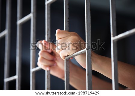 hand in jail Royalty-Free Stock Photo #198719429