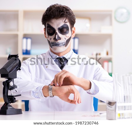 Scary monster doctor working in lab Royalty-Free Stock Photo #1987230746