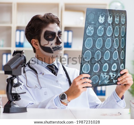 Scary monster doctor working in lab Royalty-Free Stock Photo #1987231028