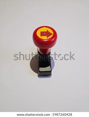 Closed up red handle stamper on white background