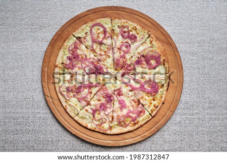 Pizza. Food. Wooden plank. Professional kitchen. Gray background