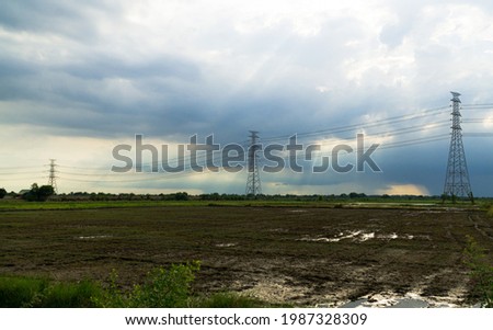 landscape of eletricity post with cloudy sky after raining 