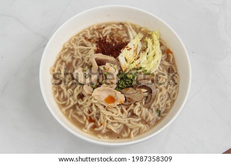 Photo of freshly cooked Filipino dish called Batchoy or noodle soup with pork and beef in chicken stock.