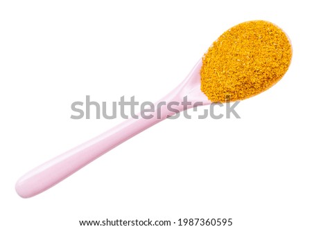 top view of ground dried tagetes (imeretian saffron) in ceramic spoon isolated on white background